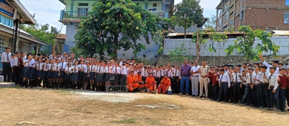 Officials from Fire and Emergency Services, Kiphire with participants during a fire evacuation drill and rescue method training conducted at Saramati Modern View High School, Kiphire.